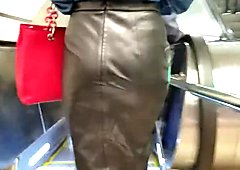 Sexy slim girl in a leather skirt