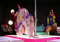 Clown Leya Falcon plays with a big purple dildo