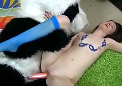 Young Girl In Her Cute Blue Dress Plays With Her Stuffed Panda